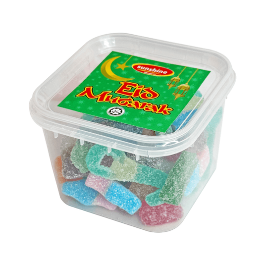 A plastic tub filled with small, colorful fizzy candies, with a green lid and label displaying the product name and branding.